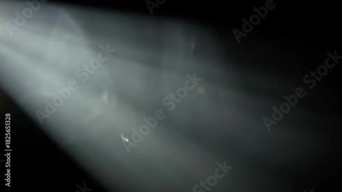 Ethereal Light Beam Cutting Through Dark Smoke with Subtle Background Effects