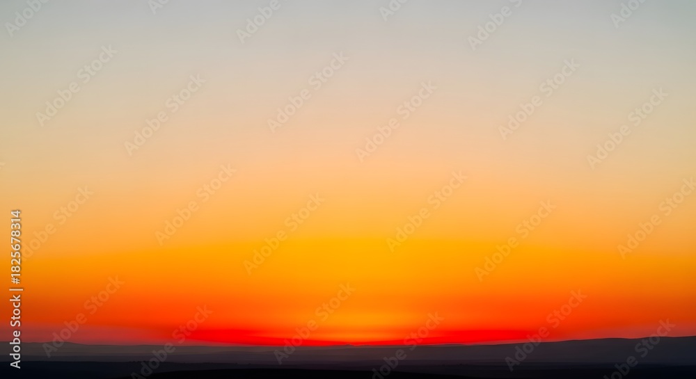 Obraz premium Warm Horizon Fiery Colors of a Sunrise Casting a Vibrant Glow Across the Sky, Inspiring Hope and Serenity