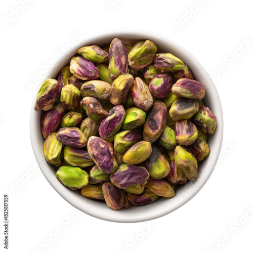 Shelled pistachios in white bowl overhead view isolated on a transparent background