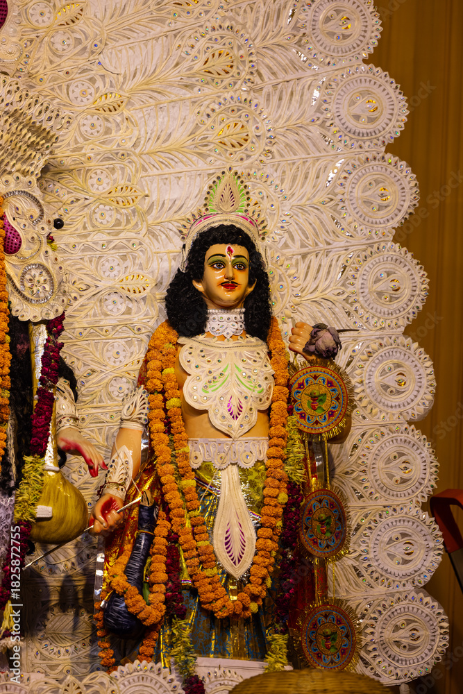 Fototapeta premium Subho mahalaya, An handmade colorful idol of hindu god kartikeya decorated in Pandal during navratri festival.