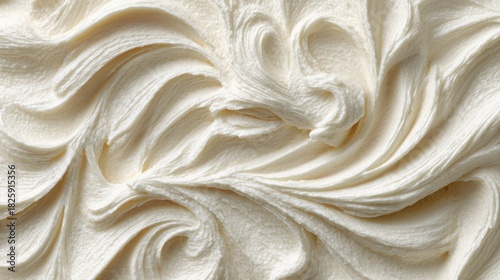 Close-up of creamy white frosting, perfect for cakes and desserts