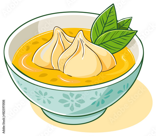 Delicious dumplings floating in a flavorful broth with fresh green leaves in a decorative bowl