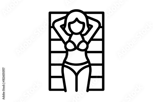 Woman sunbathing on a striped beach towel wearing a bikini during summer vacation holiday