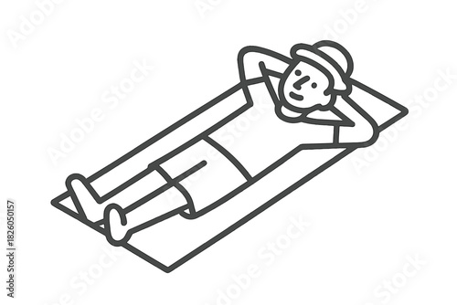 Person wearing a hat lying down on a mat relaxing during leisure time