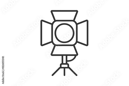 Professional film studio spotlight with adjustable barn doors mounted on a sturdy tripod