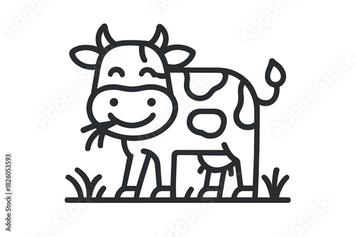 Adorable spotted dairy cow standing on green pasture eating hay with a happy smile