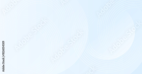 Light blue abstract background with soft circular shapes and blur effect.