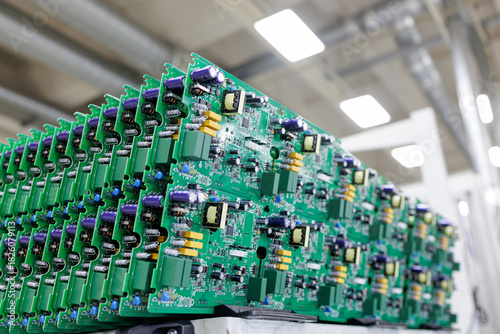 Tablou pe pânză Rows of assembled power electronics circuit boards in modern manufacturing facto