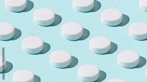 shallow. White tablets arranged in a geometric pattern on a light blue surface. STEM education sheets, lab safety posters, designed for biotech research communications, used by art directors.