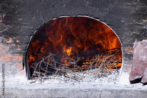 Burning Wood Inside Traditional Stone Oven