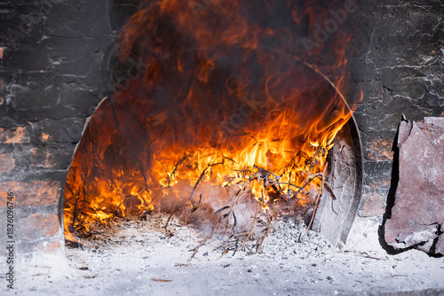 Burning Wood Inside Traditional Stone Oven