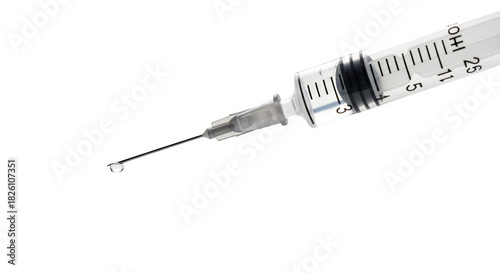 Close up of hypodermic needle with a drop isolated on transparent background