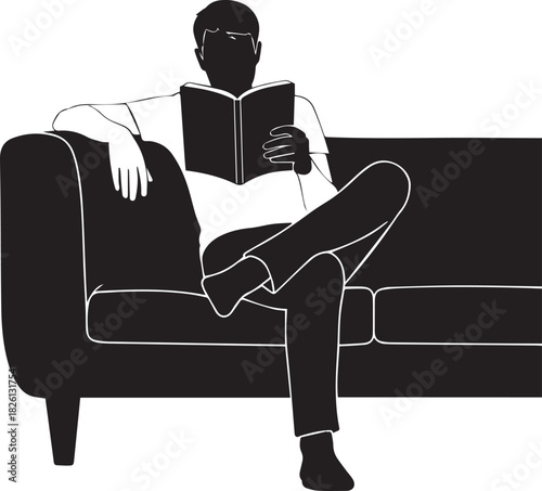Man enjoying leisure time reading book relaxing comfortably on sofa silhouette