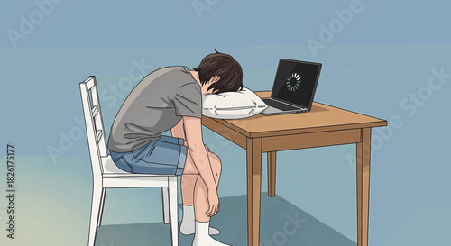Young man sleeping on a pillow at a wooden desk with an open laptop displaying a loading icon, indicating exhaustion or overwork.