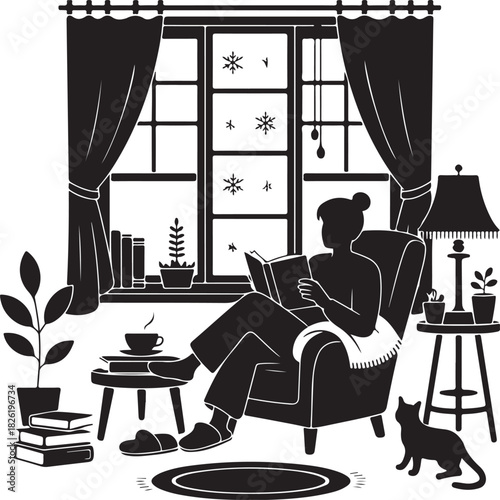 Cozy winter day indoors reading a book with a cat