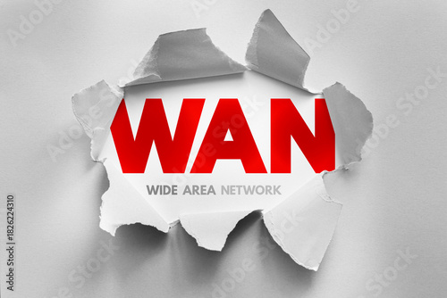 WAN Wide Area Network shown through a torn paper design, representing global network connectivity, telecommunications, internet infrastructure, data transfer, and long-distance communication