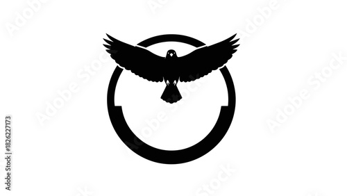 A black silhouette of a bird of prey with outstretched wings inside a circular emblem.
