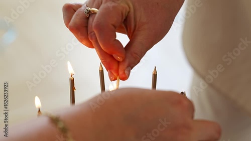 Lighting candles in a serene setting for reflection