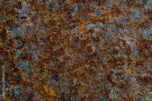 Abstract background with old rusty metal surface, closeup. Orange worn rusty metal texture