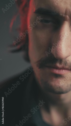 Dramatic, Sad, Painful Expressions of a Young Attractive White European Man with Mustache and Long Hair Transitioning from Tension to Relaxation and Smile
