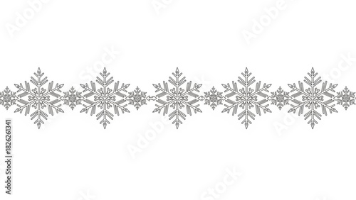 Row of snowflakes in varying sizes and intricate designs arranged horizontally across the white background silhouette
