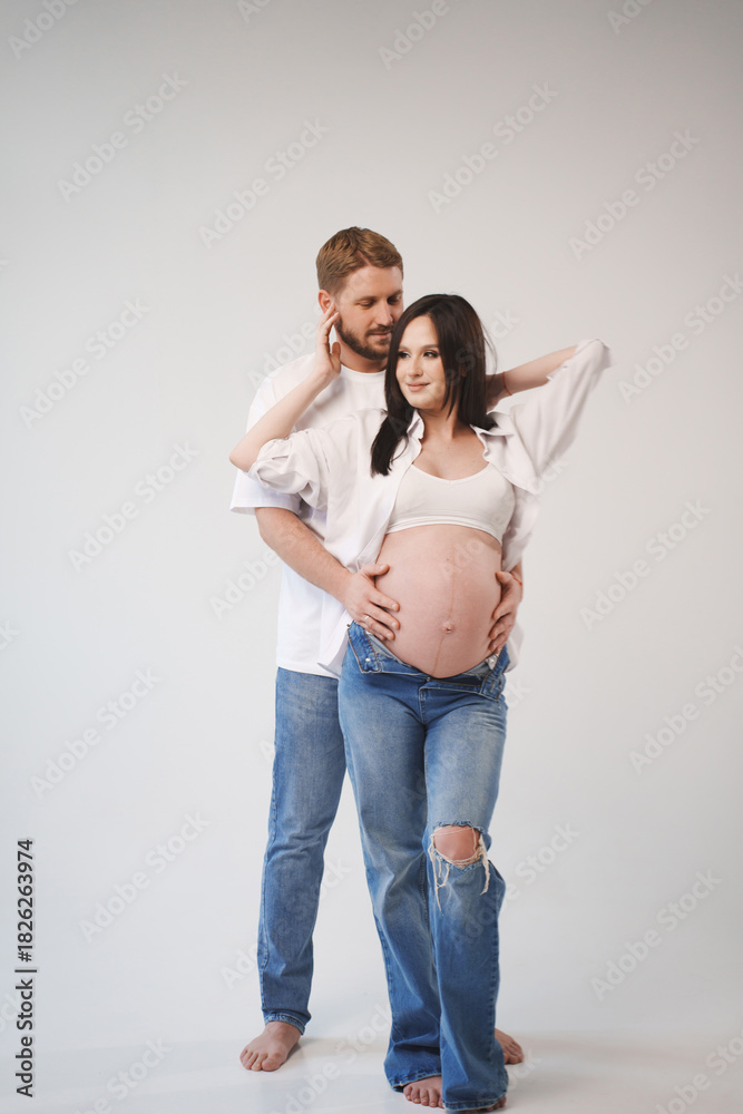 Fototapeta premium Couple sharing a tender moment before baby arrives