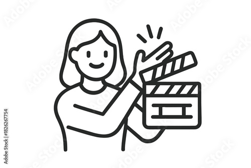 Smiling filmmaker holding a clapperboard ready for action on a movie set