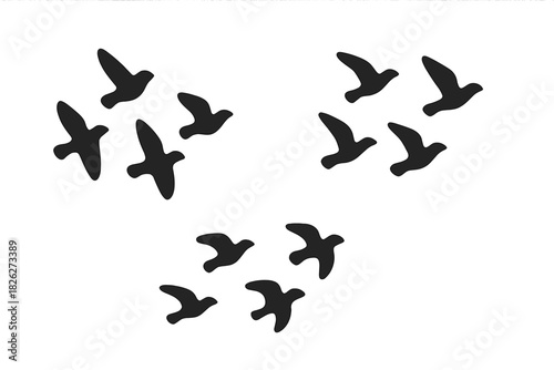 Minimalist black silhouettes of flying birds grouped in three separate flocks against a white background