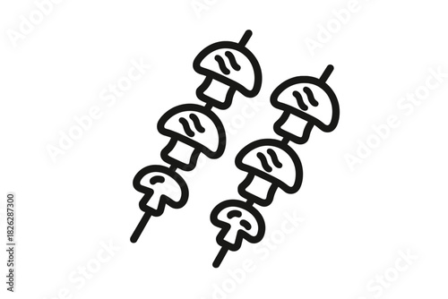 Two mushroom skewers prepared for grilling, representing vegetarian barbecue food preparation