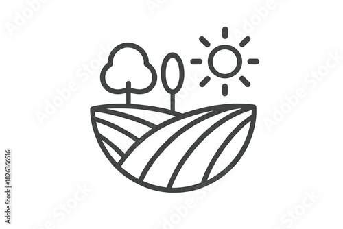 Rolling cultivated fields and trees under a bright shining sun in a rural landscape