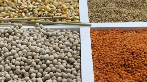 Colorful assortment of grains and pulses on display in a local market in the afternoon sun