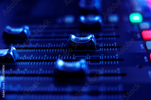 Concert sound mixer panel with volume regulators. Professional audio and light equipment for sound recording studio, live music broadcasting, television, party. mixing console. audio signals