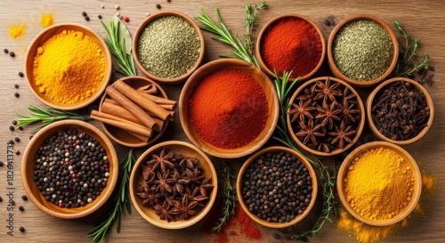 Fototapeta Naklejka Na Ścianę i Meble -  Variety of spices and herbs displayed in bowls overhead view