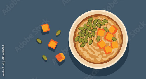 Delicious and healthy warm oatmeal bowl with diced pumpkin and pumpkin seeds, served on a dark blue background, flat lay style.