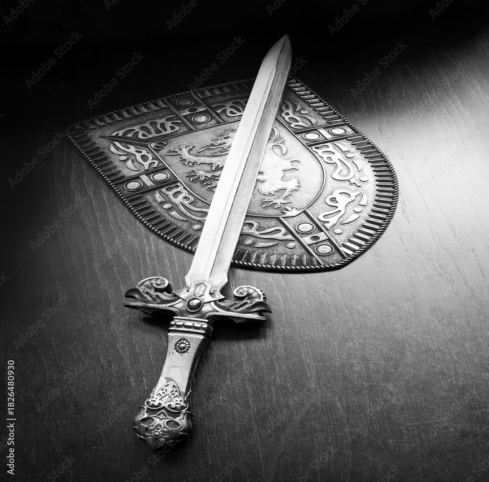 Fototapeta premium Iron shield and sword on the table