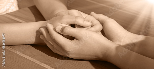 Close-up view of comforting hands