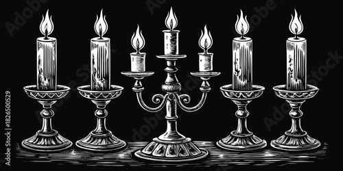 Antique candelabra and candlesticks with burning candles on a dark background