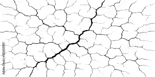 Dry cracked earth texture of the desert ground and old wall