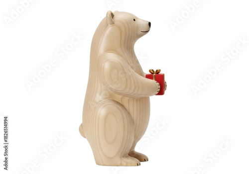 Isolated wooden polar bear figurine holding a small red gift box, cute Christmas decoration