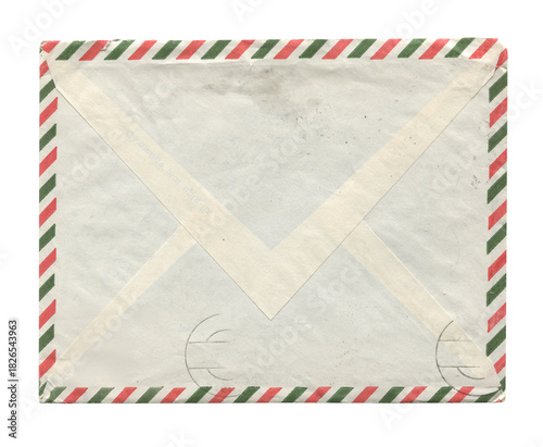 front view of old closed aged airmail DL envelope with faded stamp isolated on white