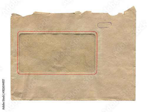rear view of old closed aged paper envelope with address window and torn top isolated on white
