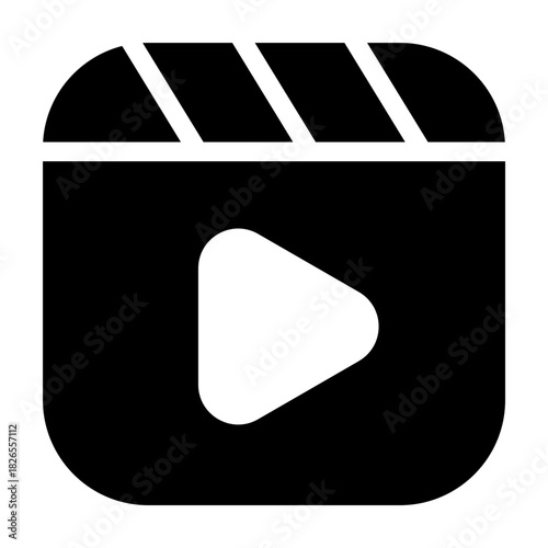 Bold glyph icon of a movie clapboard, filled video production symbol.