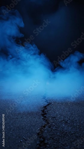 A crack in a dark, textured surface, illuminated by ethereal blue smoke or vapor