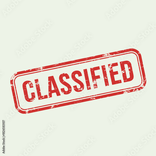 A red rectangular rubber stamp with the word "CLASSIFIED" in bold uppercase letters, featuring a grunge texture on a light background.