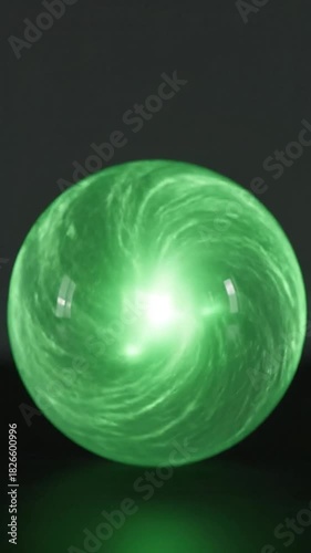 A glowing green sphere with internal cloud-like swirls. Intense light radiates from the center