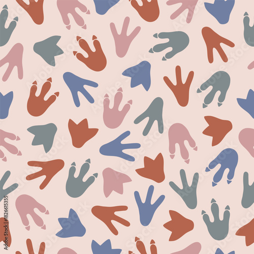 Seamless pattern with colorful dinosaur footprints on beige background. Template for print, fabric, wallpaper, wrapping paper