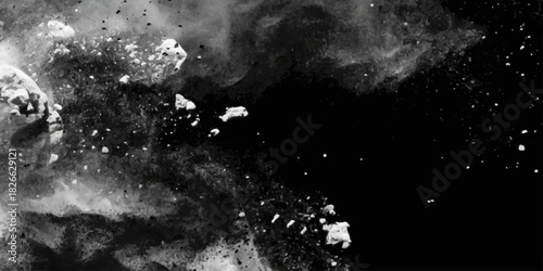 Grunge black and white distressed texture with scattered speckles and blotches for abstract background. dynamic display, sending dust and debris flying into the air against a clean white backdrop.