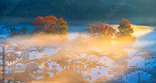 Sunrise, autumn colors, and beautiful rural scenery at Shicheng Red Maple Scenic Area, Wuyuan, Shangrao, Jiangxi, China