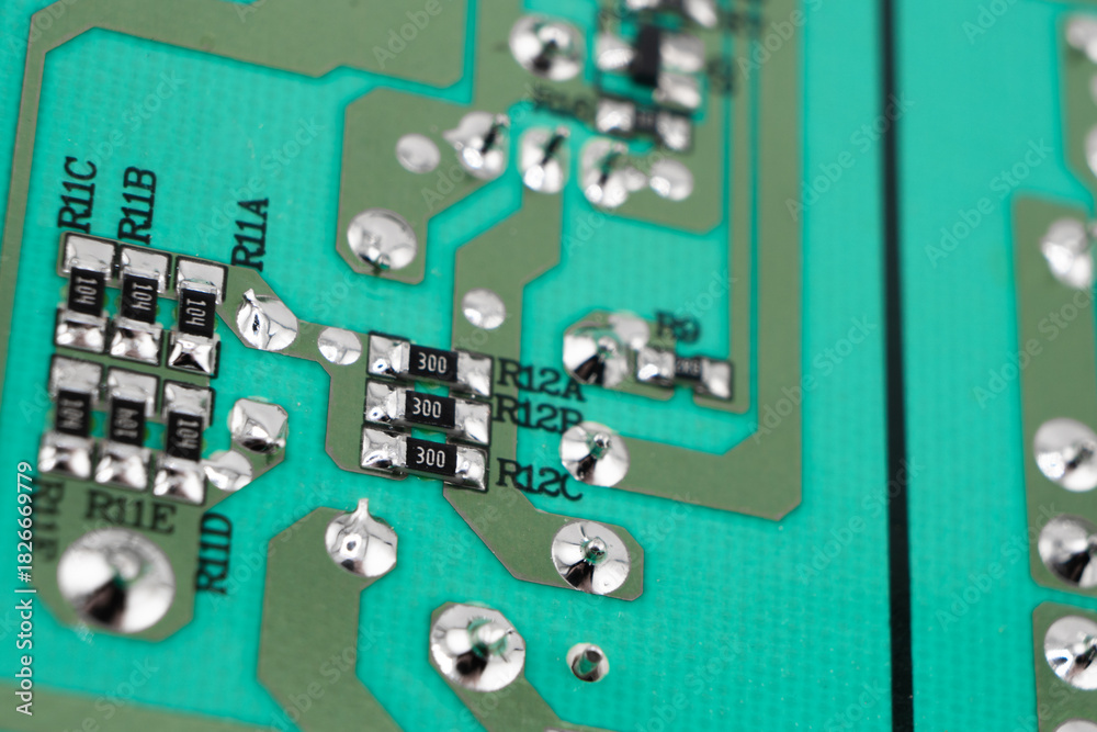 Fototapeta premium Circuit board with resistors microchips and electronic components background. Computer hardware technology. Integrated communication processor.