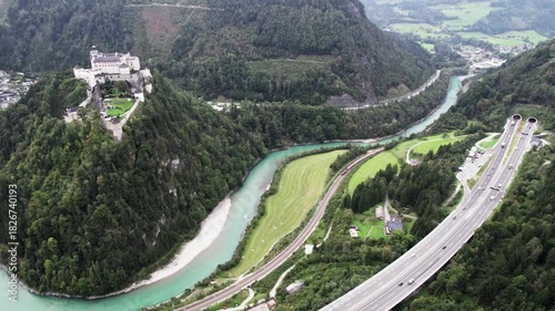 Drone turn above Tauern motorway toward Werfen Castle and Salzach river
